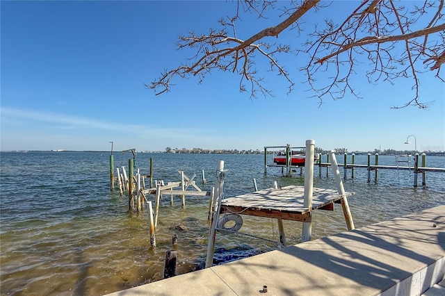 view of dock featuring a water view and boat lift