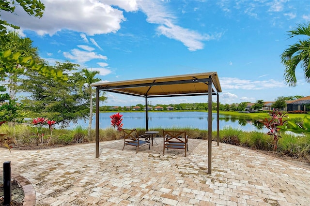 view of patio / terrace with a gazebo and a water view