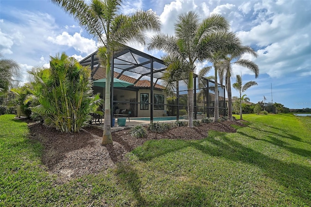 exterior space with a yard and a lanai