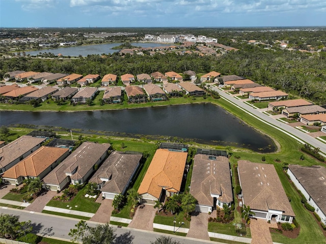 bird's eye view with a residential view and a water view