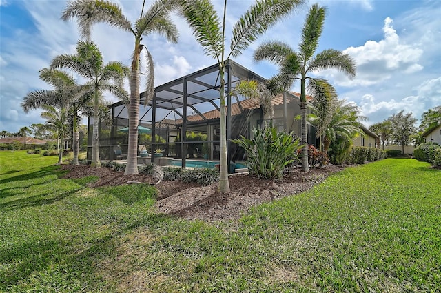 view of yard featuring a lanai and an outdoor pool