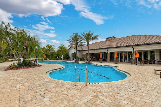 community pool featuring a patio area