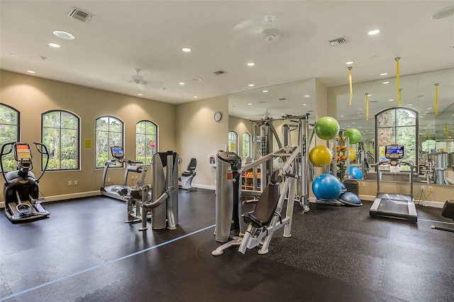 workout area featuring recessed lighting, visible vents, and baseboards