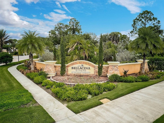 community sign featuring a lawn