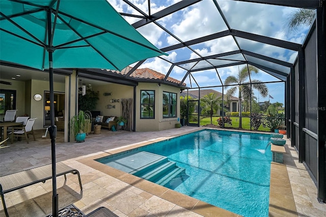 pool with a patio and a lanai