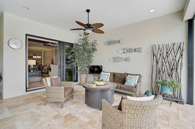 view of patio with outdoor lounge area and a ceiling fan