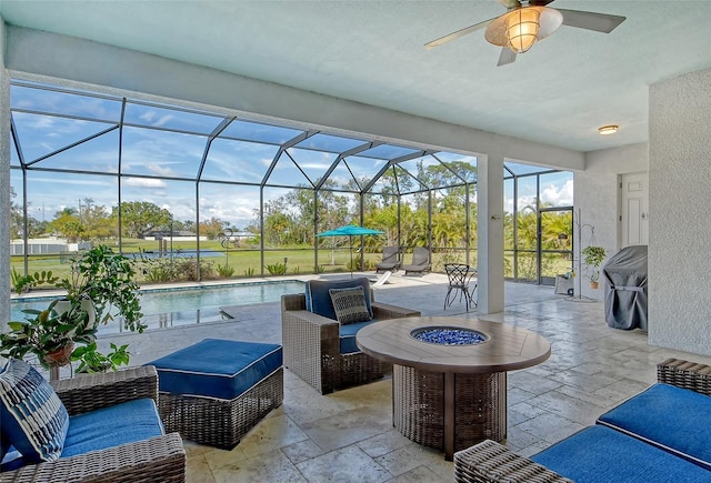 view of patio / terrace with an outdoor hangout area, glass enclosure, a ceiling fan, and an outdoor pool