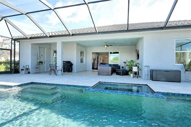 back of house featuring ceiling fan, a tile roof, a patio, and stucco siding