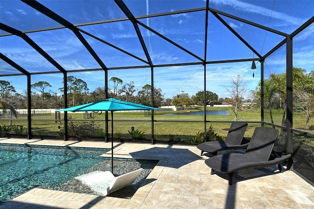 pool with glass enclosure, a yard, and a patio area