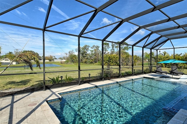 pool featuring glass enclosure, a yard, and a patio