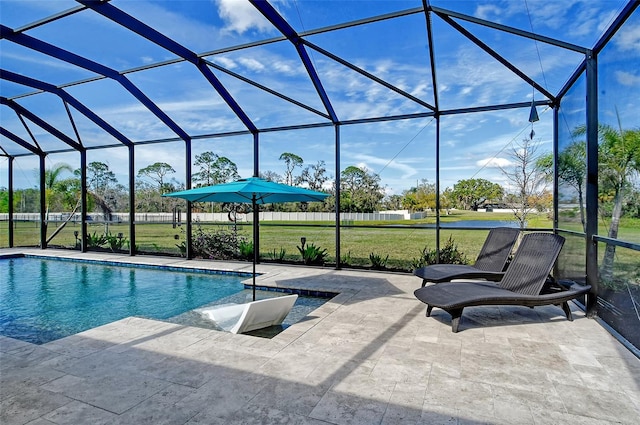 outdoor pool featuring a yard, a lanai, and a patio