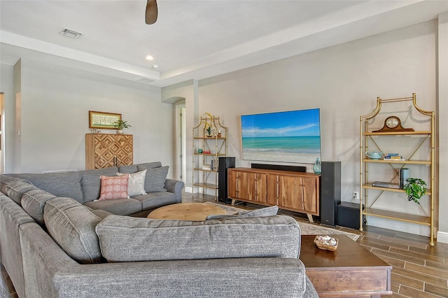 living area with visible vents, baseboards, a ceiling fan, wood tiled floor, and recessed lighting