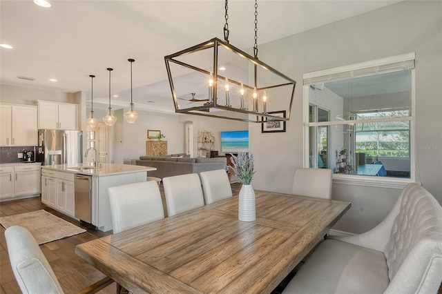 dining room with dark wood-style floors and recessed lighting