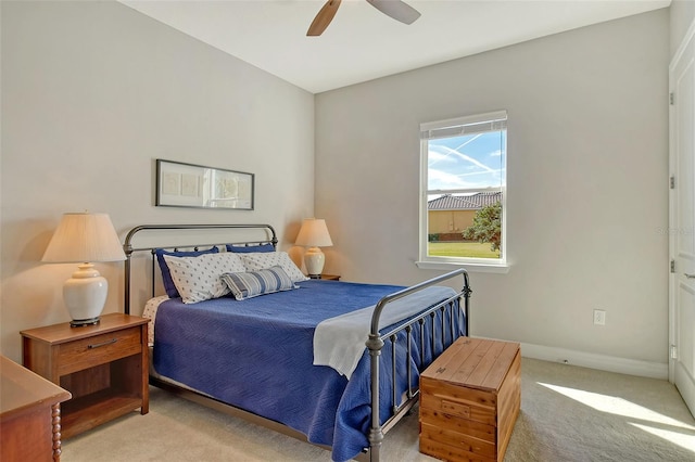 bedroom featuring carpet floors, baseboards, and a ceiling fan