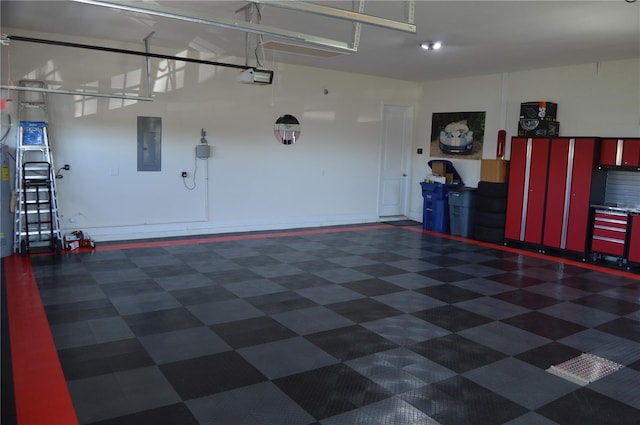 garage featuring electric panel and a garage door opener