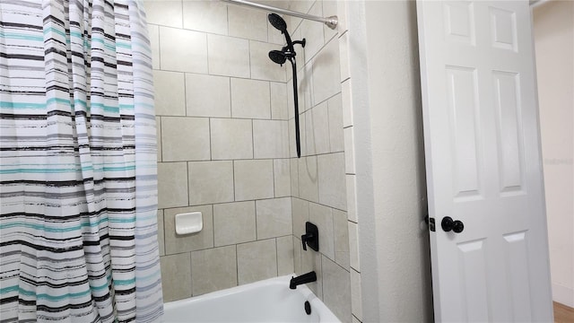 bathroom featuring shower / bathtub combination with curtain