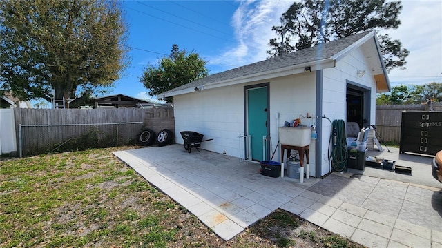 view of outbuilding featuring an outbuilding and a fenced backyard