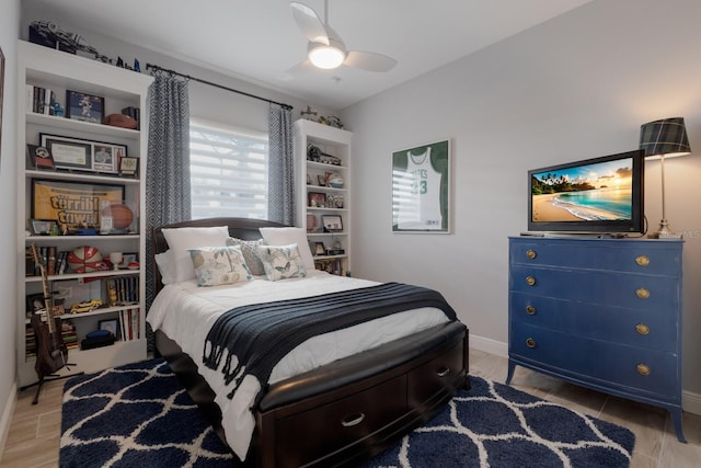 bedroom featuring ceiling fan and baseboards