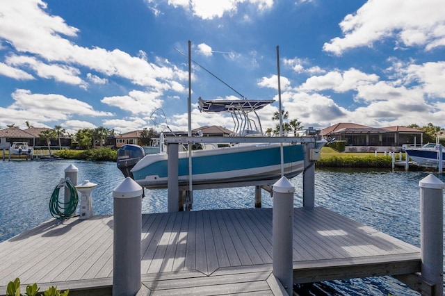 view of dock featuring a water view and boat lift