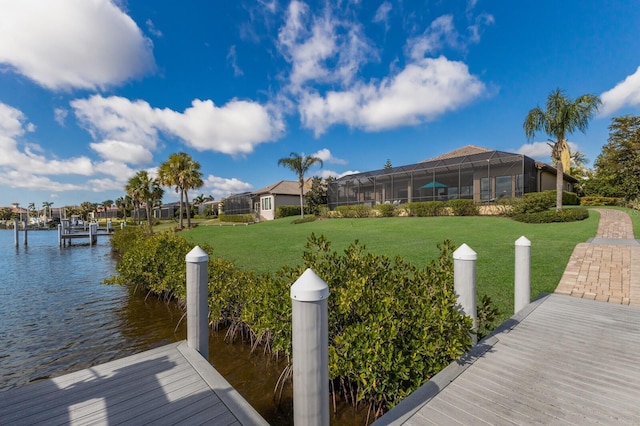 dock area featuring a water view and a yard