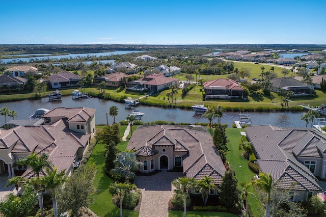 bird's eye view featuring a water view and a residential view