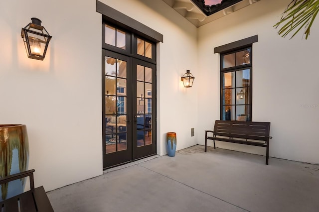 doorway to property with stucco siding and french doors