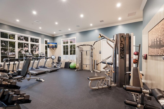 workout area featuring ornamental molding, recessed lighting, and visible vents