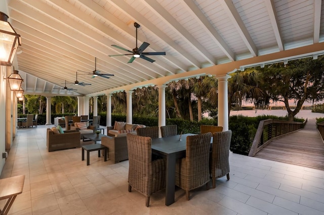 view of patio / terrace featuring outdoor dining area, ceiling fan, and an outdoor living space