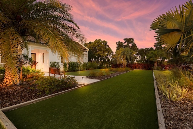 view of yard at dusk