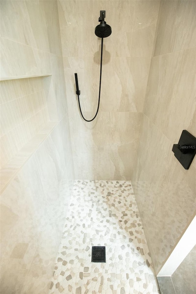 room details with a tile shower