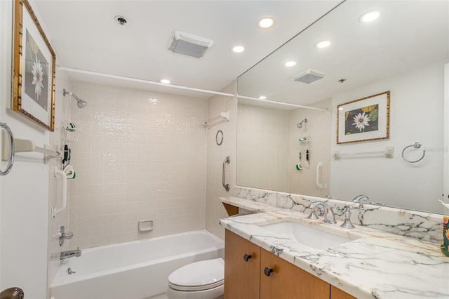 bathroom featuring toilet, recessed lighting, bathtub / shower combination, and vanity