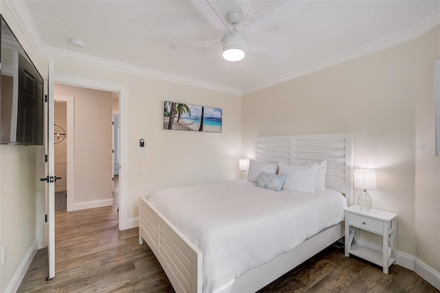 bedroom with ornamental molding, ceiling fan, baseboards, and wood finished floors