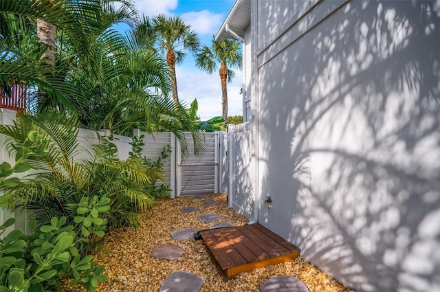 view of property exterior featuring fence