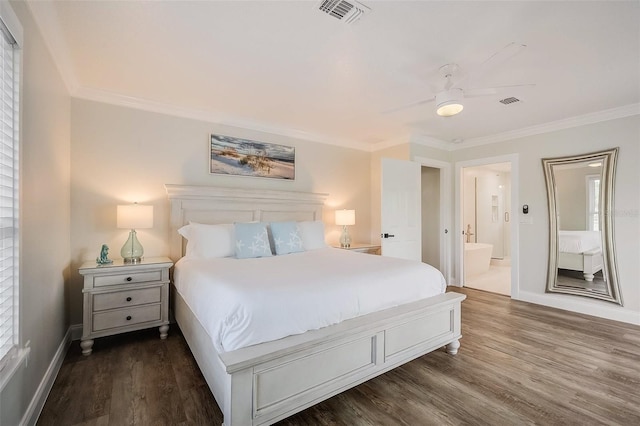 bedroom featuring visible vents, crown molding, and wood finished floors