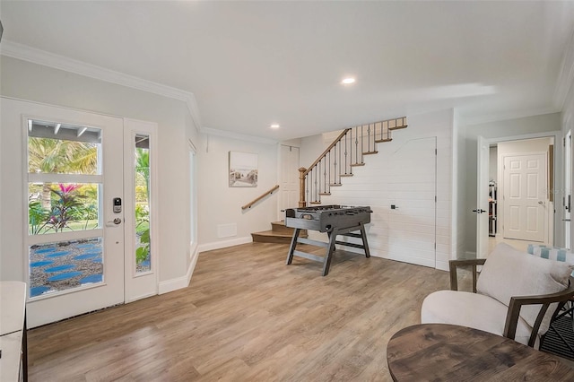 entrance foyer featuring recessed lighting, stairway, ornamental molding, light wood-type flooring, and baseboards