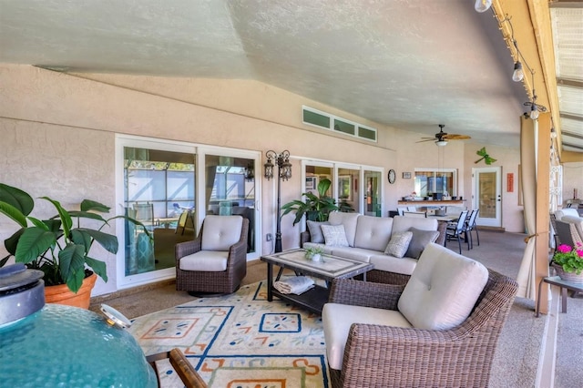 exterior space featuring french doors, ceiling fan, and an outdoor living space