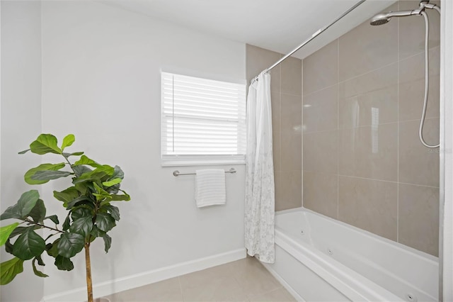 full bath with baseboards, shower / bath combo with shower curtain, and tile patterned floors