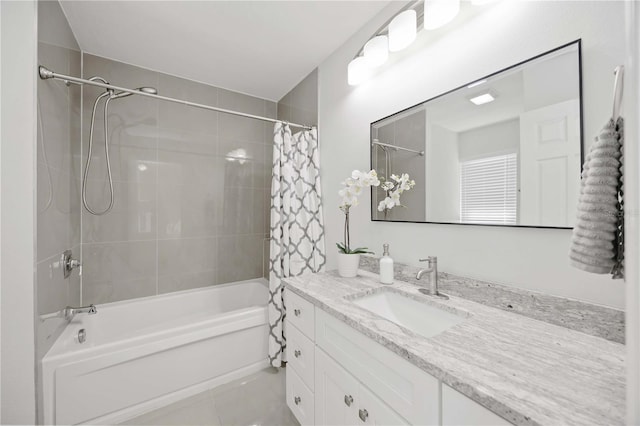 bathroom featuring vanity and shower / bath combo with shower curtain