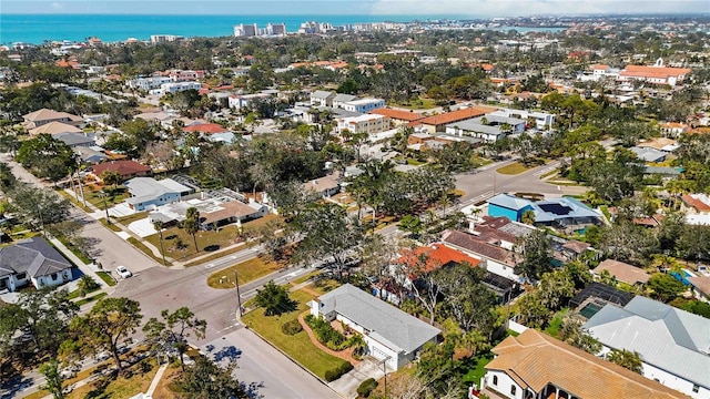 birds eye view of property with a water view and a residential view