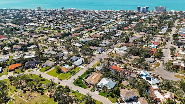 birds eye view of property with a view of city, a water view, and a residential view