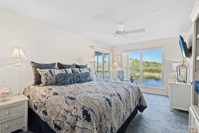 carpeted bedroom featuring a textured ceiling, access to outside, and ceiling fan