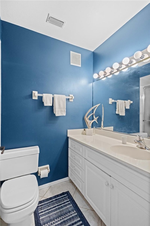 bathroom with a shower with shower door, visible vents, vanity, and toilet