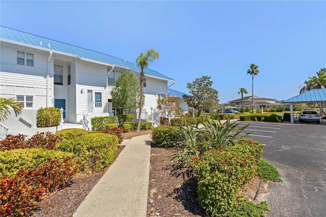 view of home's community with uncovered parking and a residential view