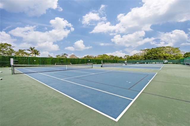 view of sport court featuring fence