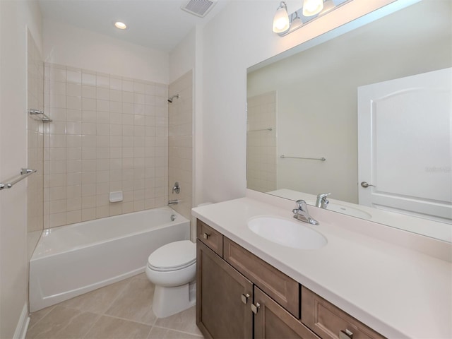 full bath with visible vents, toilet, vanity, shower / tub combination, and tile patterned floors