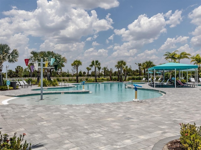 pool featuring a patio area and fence