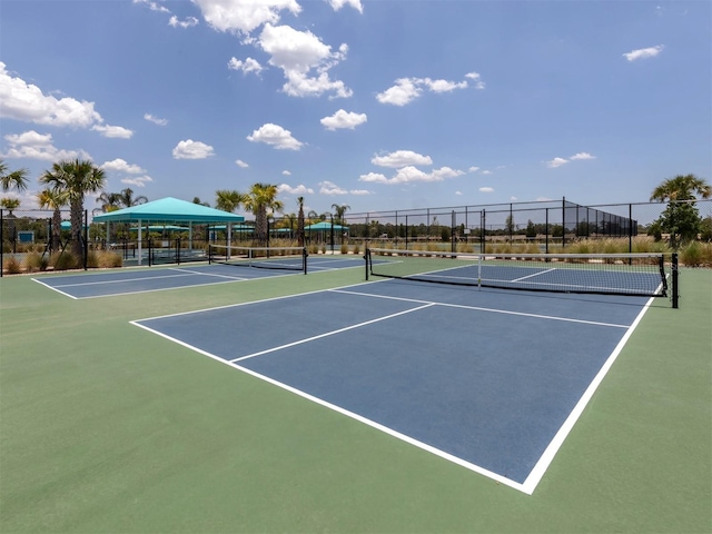 view of sport court featuring fence