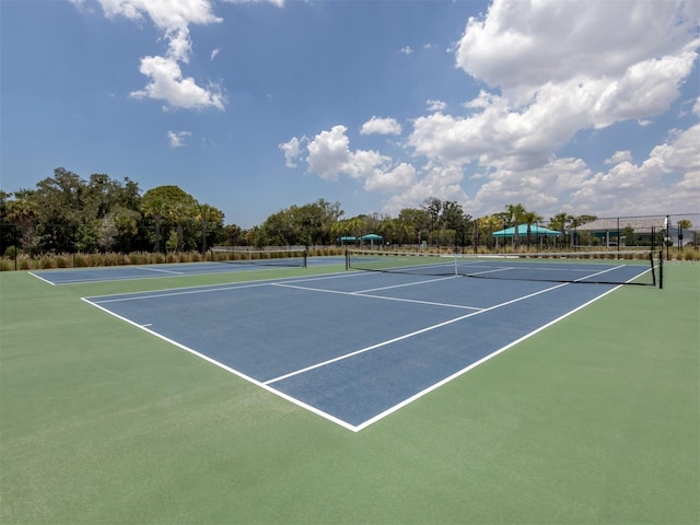 view of sport court with fence