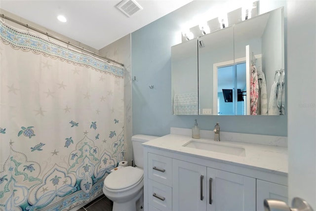 bathroom with a shower with shower curtain, visible vents, vanity, and toilet