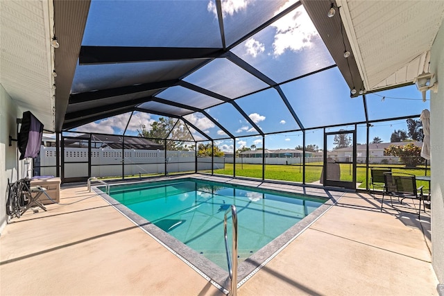 view of swimming pool with a lanai, a yard, and a patio